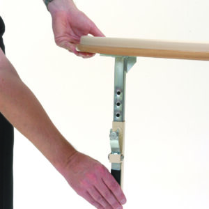 Hand of a man operating handles on the table