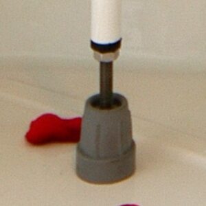 grey crutch tip attached to metal leg